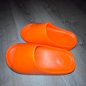 orange YEEZY slides